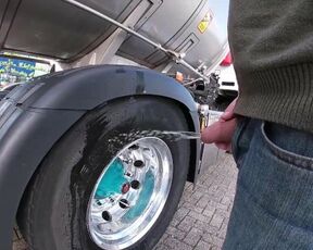 Pissing against a truck tire