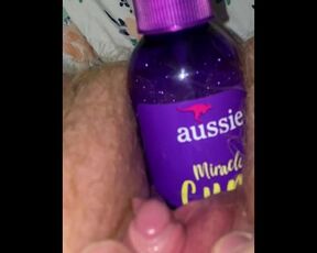 Redhead inserts bottle