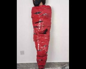 NANA Mummified with red plastic tape and then played with for orgasms