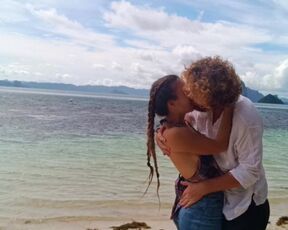 Hot couple in love passionately kissing on a remote tropical island